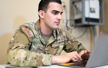 Soldier working on laptop